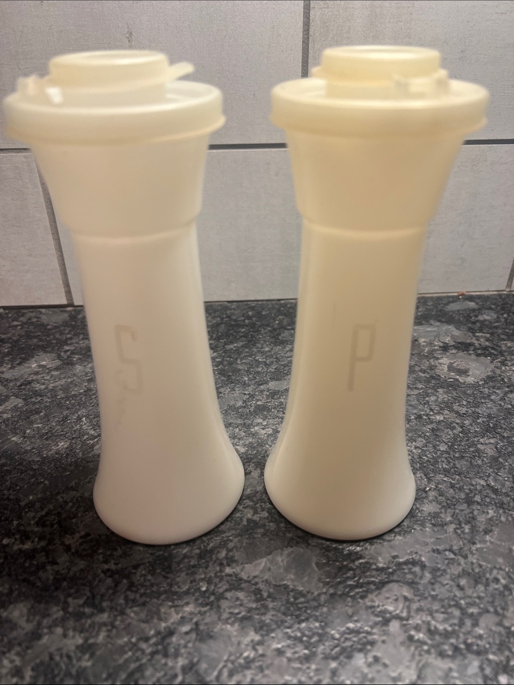 Tupperware White Plastic Salt and Pepper Shakers Set. Great shape